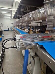 Conveyor belt system used in industrial and processing facilities for efficient material handling.