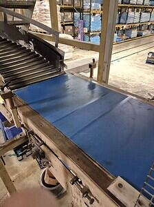 Conveyor belt system used in industrial and processing facilities for material handling and transpor.