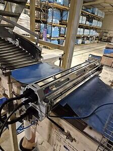 Conveyor belt system used in industrial and processing facilities for efficient material handling.