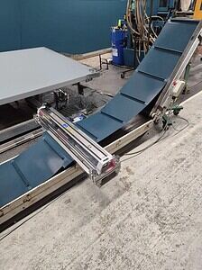 Vulcanising conveyor belt for industrial applications at Premier Belting Services.