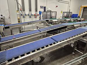 Conveyor belt system supplied by Premier Belting Services for manufacturing facilities.