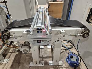 Conveyor belt manufacturing machinery for industrial applications.