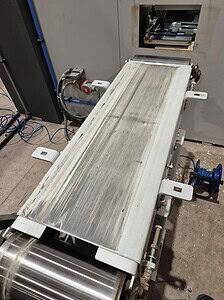 Conveyor belt manufacturing machinery for industrial applications.
