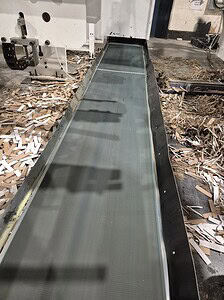 Industrial conveyor belt used in manufacturing facilities for material handling.