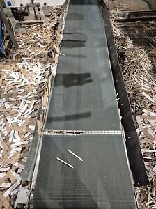 Industrial conveyor belt used in manufacturing facilities for material handling.