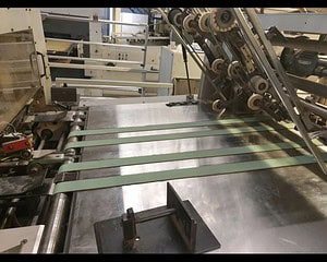 Industrial conveyor belt vulcanising process in manufacturing plant.
