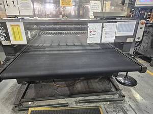 Vulcanising conveyor belt for industrial repair and maintenance.