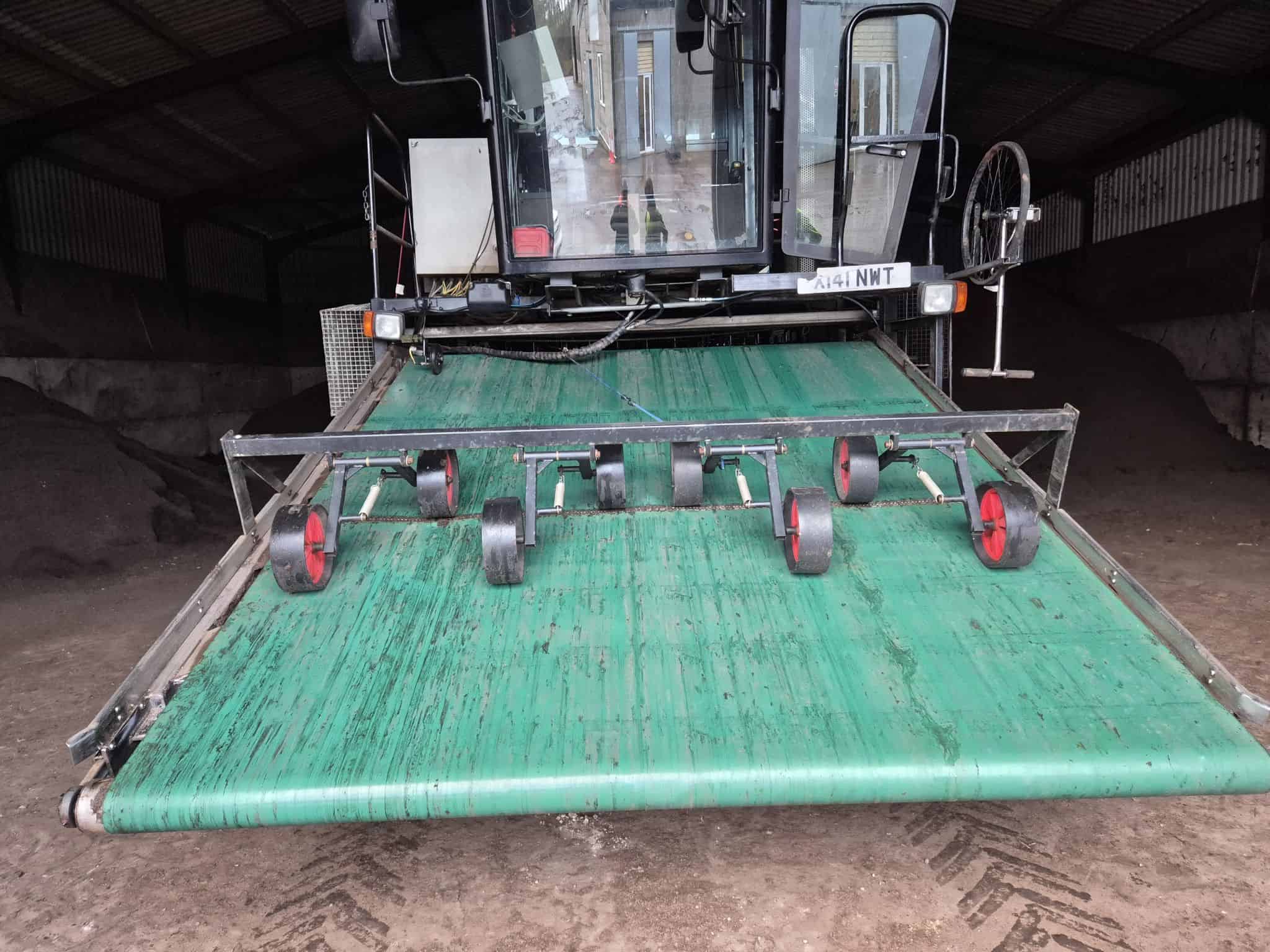 Conveyor belt used in farming and agricultural machinery for material handling.