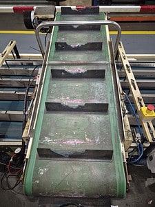 Heavy-duty conveyor belt used in industrial manufacturing processes.