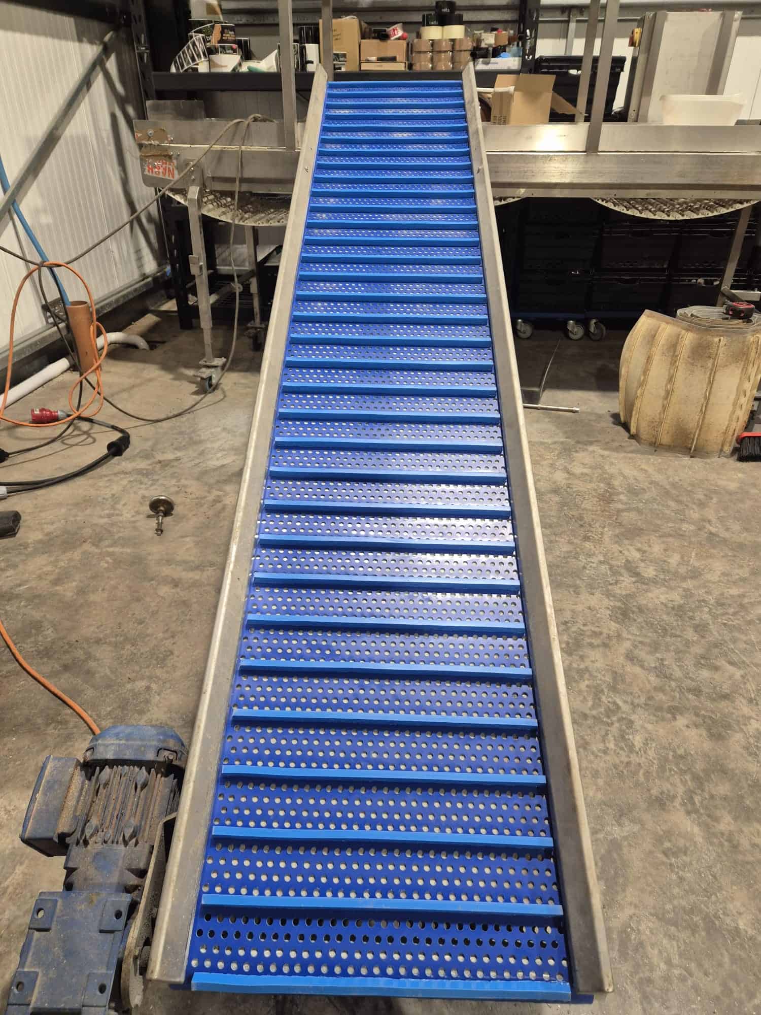 Heavy-duty blue conveyor belt for industrial material handling.